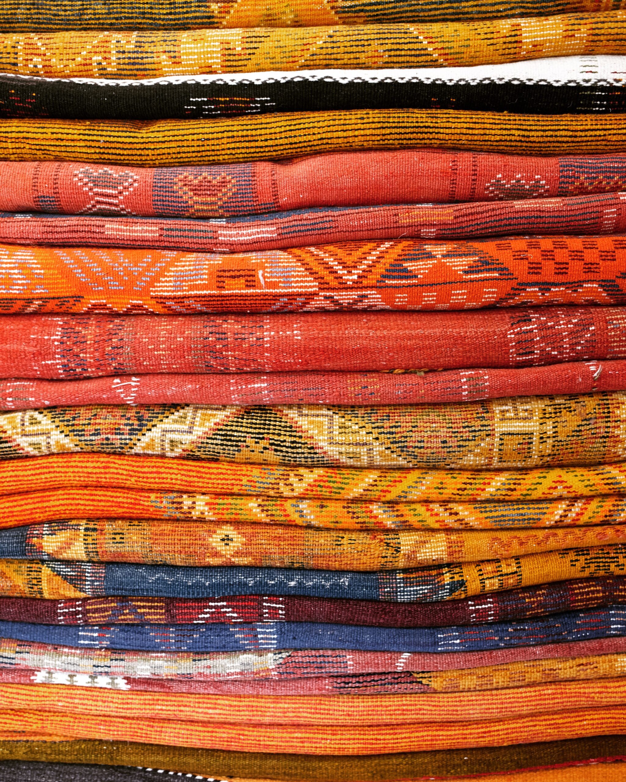 An image of colourful Moroccan Bedouin rugs from Ourica.