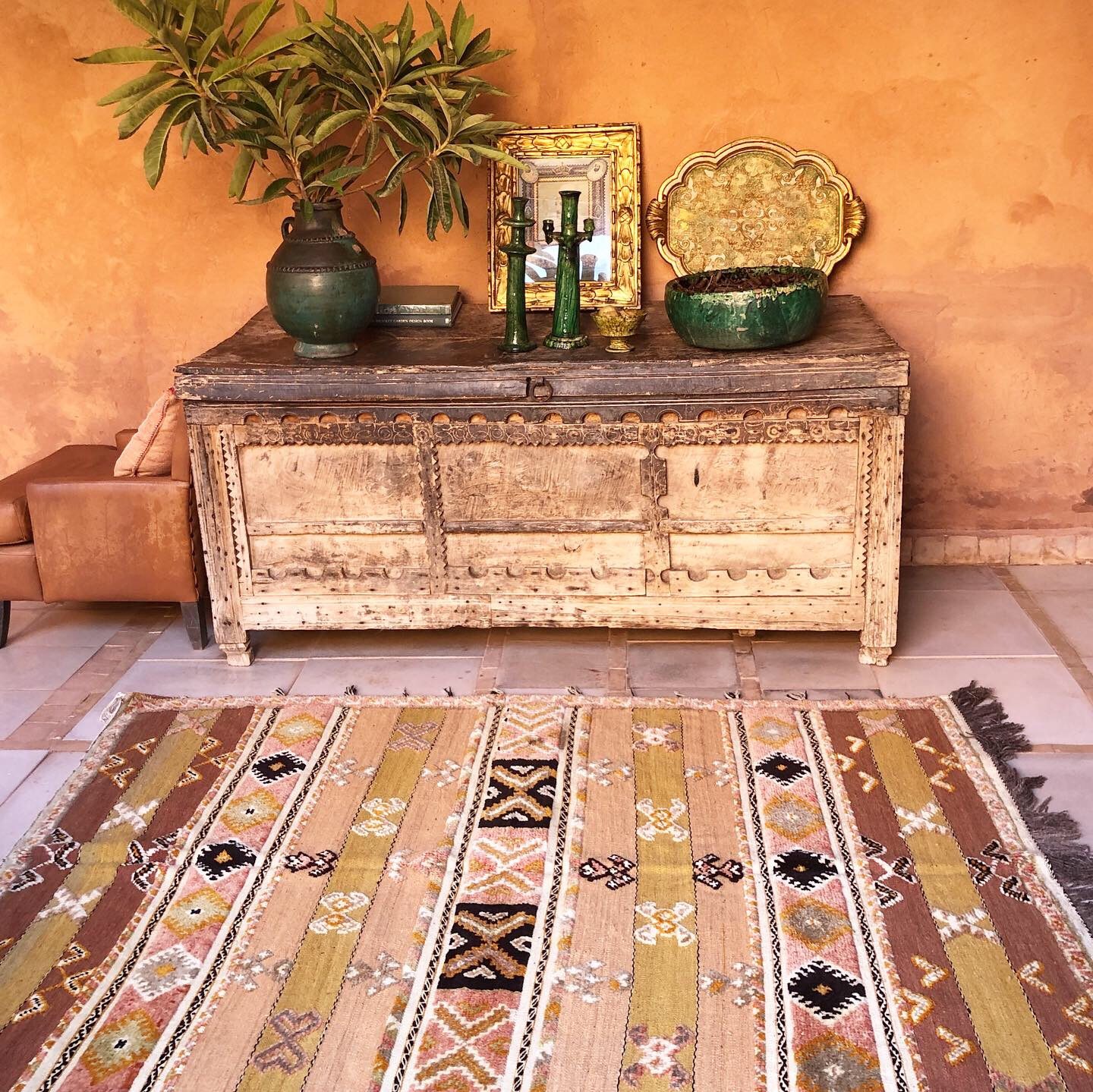 An image in the Casbah Babourika with the Desert Rose pastel coloured Moroccan rug and antique furniture.
