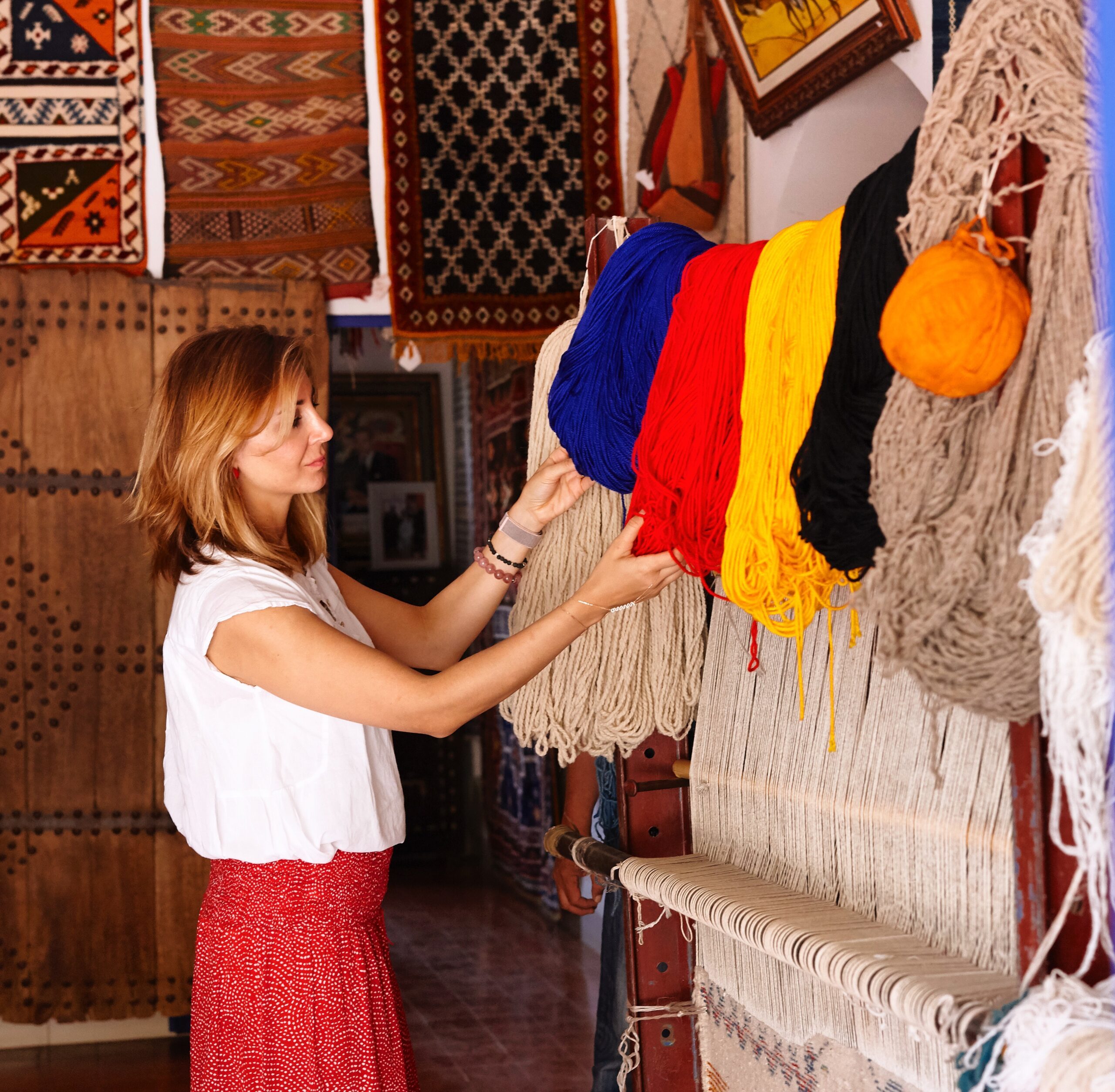 Zeynep Ugan from the Desert Rose looking at wool colours used for handmade rugs int he Bedouin village.