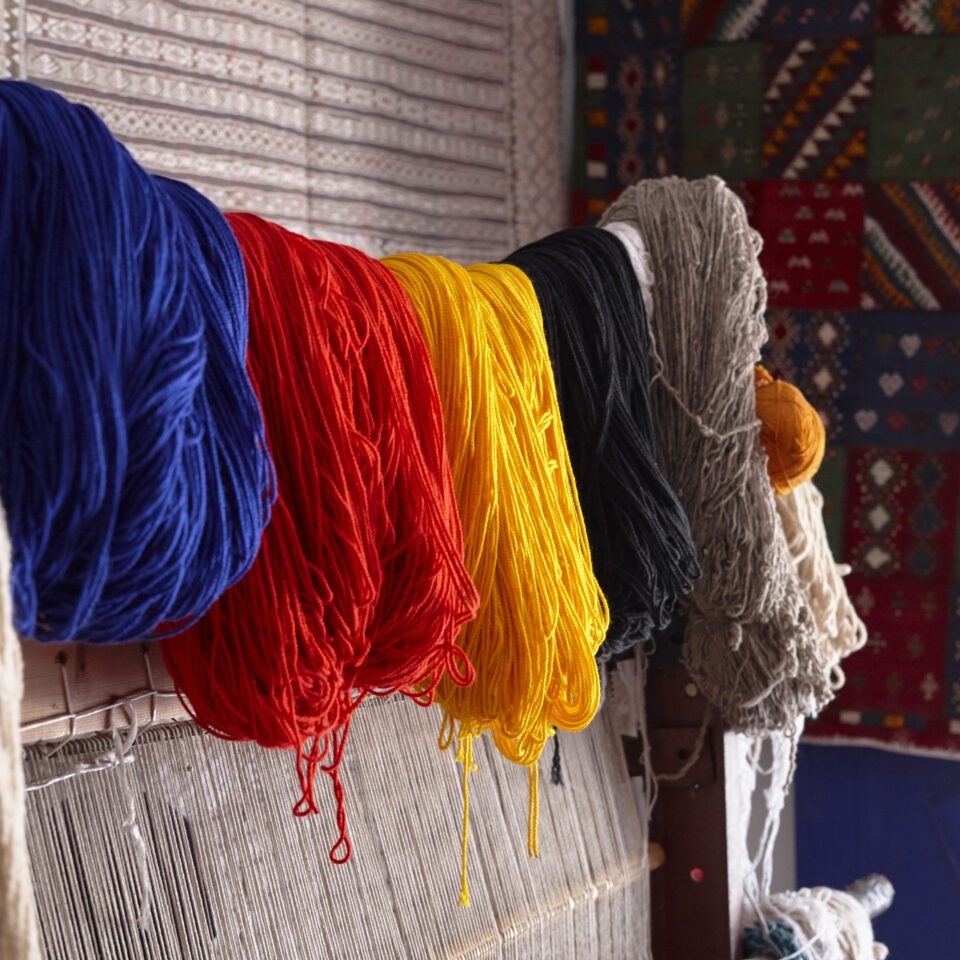 Yellow, red and blue wool yarns in Moroccan rug making